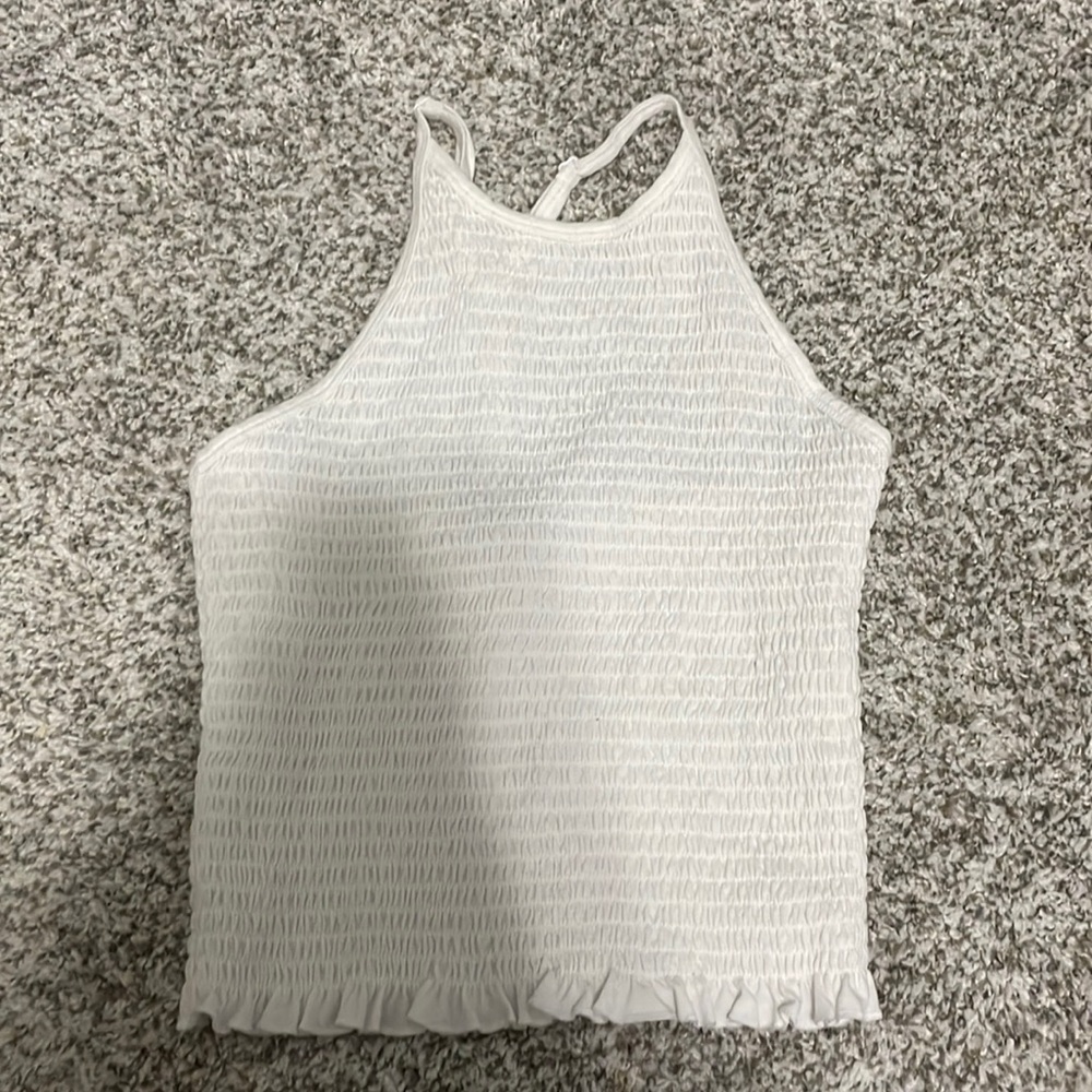White kind of crop top, worn twice, ( once in family photos )